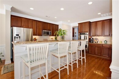 Gas range and double ovens complete this wonderful