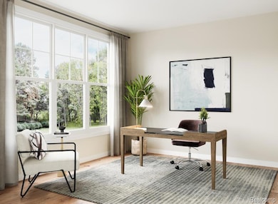 Office area featuring light wood-style flooring