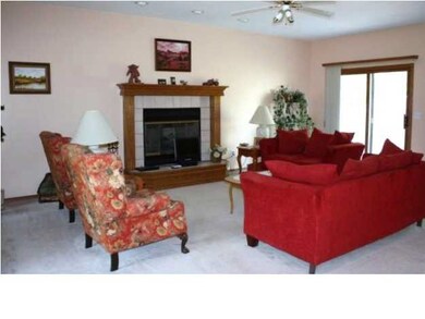Living Room with doors to the large fenced back ya