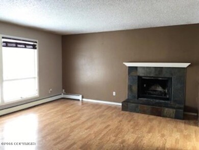 Living room and fireplace view 1