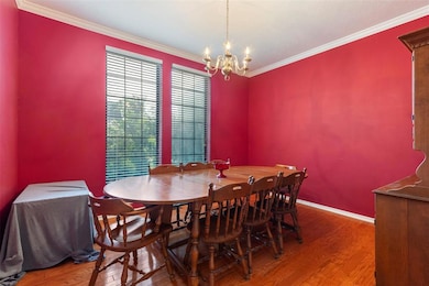Dining space with an inviting chandelier, ornament