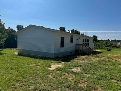 View of home's exterior with a lawn