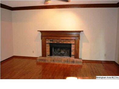 Spacious main-level den with hardwood floors, crow