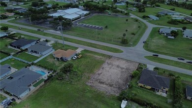 Aerial view of property's location featuring nearby suburban area