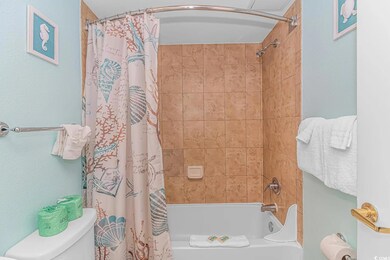 Bathroom with toilet and shower / tub combo