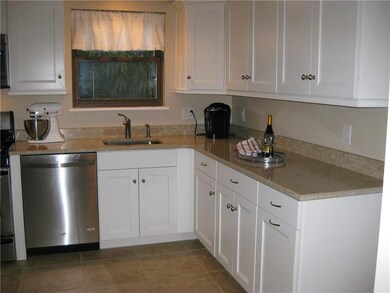 New,custom white kitchen cabinetry,with quarts cou