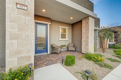 View of exterior entry featuring stucco siding