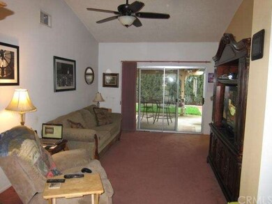 TV room located near covered patio.  Perfect space
