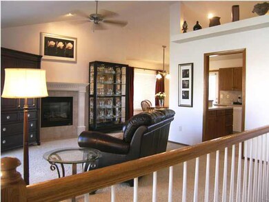 THE VIEW OF THE LIVING ROOM FROM THE TILED ENTRY F