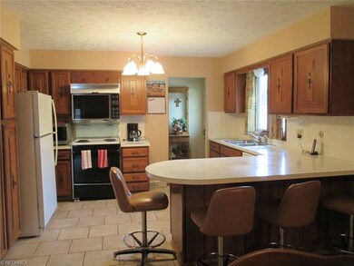 Another view of kitchen looking at the foyer
