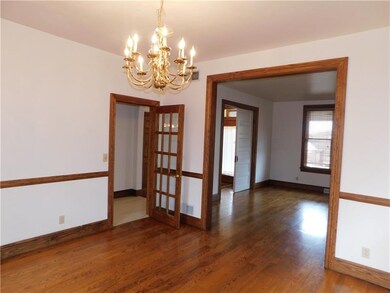 Dining room has a French door Separating  the kitc