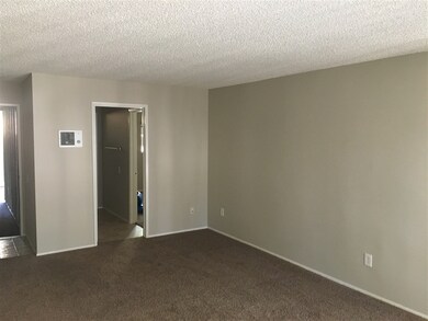 Living Room, opposite view of prior photo. Door se