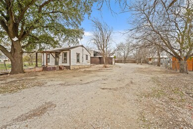 View of property exterior featuring fence