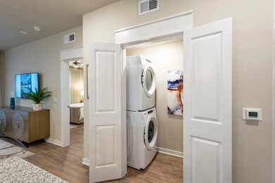 laundry - this is the furnished model, not actual unit, photo is for reference only