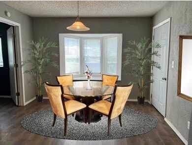 Breakfast Room has luxury vinyl floors, bay window, and access to back yard and deck.
