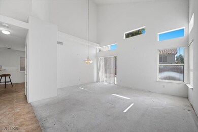 Living Room with vaulted ceiling and carpet flooring