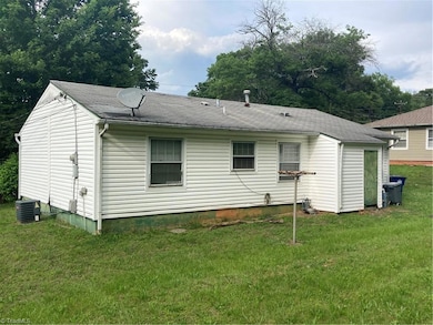 From the back of the house, it’s clear the lot (0.33 acres) is a generous size.7)Behind the green door is one of two outdoor storage rooms.  Both re in disrepair; the larger one (not pictured) is full of debris.  That's part of what seller means by 
