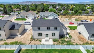 Aerial perspective of suburban area with a mountain backdrop