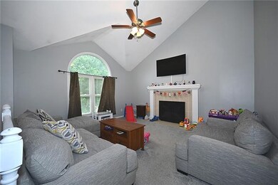 Living room with Fireplace and new carpet.