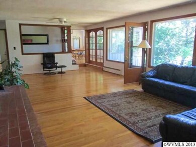 Expansive living room with hardwood floors, is pri