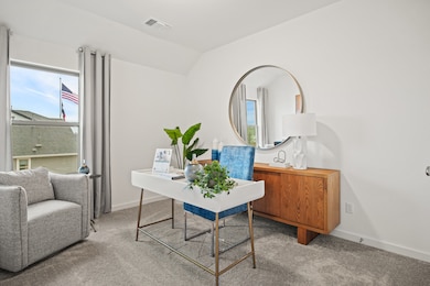Bedroom/ Home Office in a Trinity Ranch Oak Model home in Elgin TX by Trophy Signature Homes