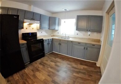 The kitchen has brand new flooring and paint.