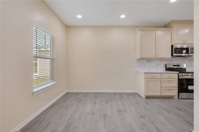 Kitchen featuring stainless steel appliances, ligh