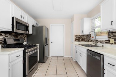 Kitchen featuring appliances with stainless steel