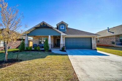 Craftsman-style house with a porch, a garage, and 