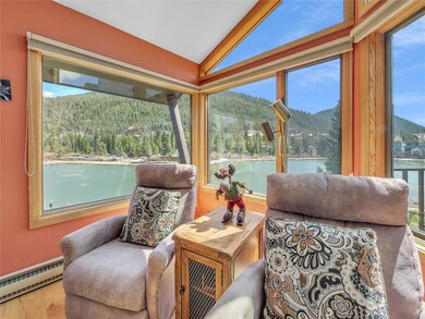 Sitting room featuring baseboard heating, lofted c