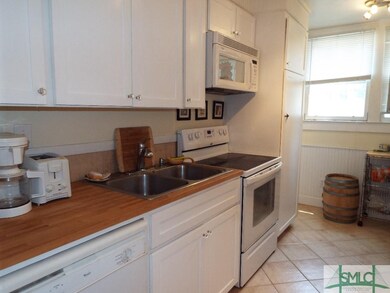 Kitchen with Wood Block Counter--Fridge on other s