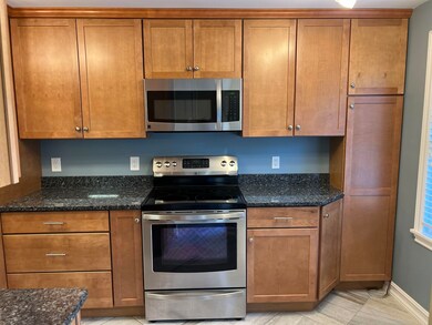 Tile floors, granite countertops, stainless steel 