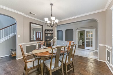 The dining room features unique crown molding and trim throughout. This room is the perfect addition for more formal get togethers and easily has space for a table of 12.