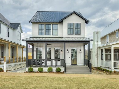 Modern inspired farmhouse with a standing seam roo