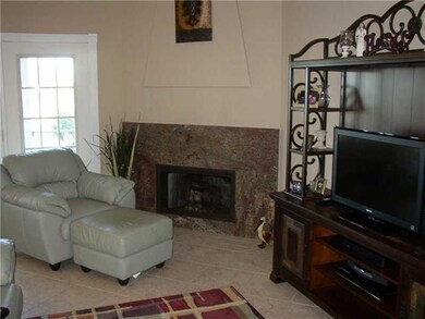 Den/Family/Great Room. VIEW OF THE CORNER FIREPLAC