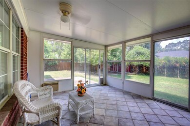 Sunroom / solarium with ceiling fan and plenty of 