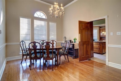 Formal dining area - wood floors - swing door to kitchen
