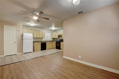 Kitchen with light wood-type flooring, baseboards