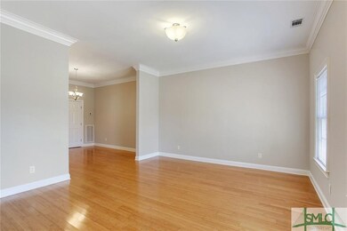 Another view of the living/dining area with partia