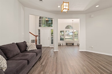 Open floor plan with one of two living areas with views to the front and back yard