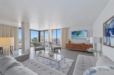 Living area featuring floor to ceiling windows