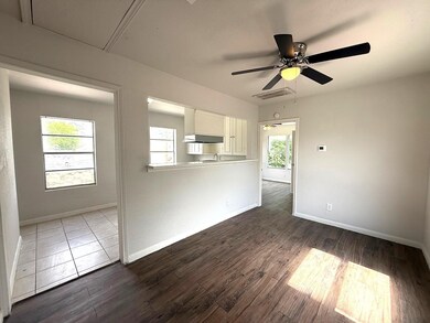 Light spills in from multiple windows in the livin
