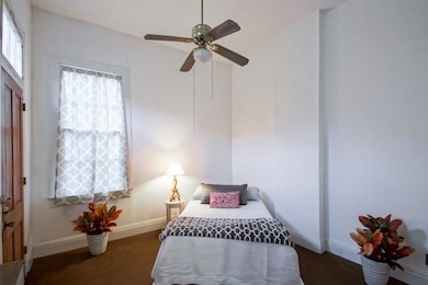 Bedroom and door to side gallery and back yard.
