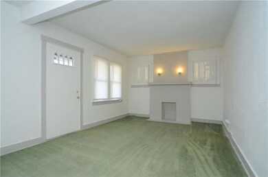 Living room with decorative mantle.