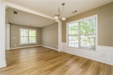 Empty room featuring visible vents, light wood-sty
