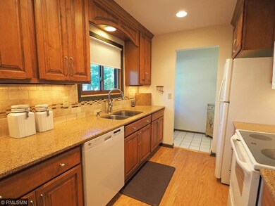 Remodeled kitchen with pullout shelves in pantry a