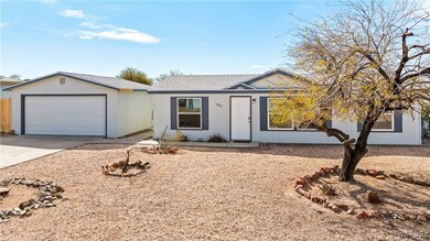 Single story home with driveway, a shingled roof,