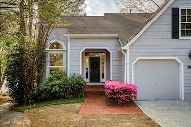 Charming Cape Cod-style façade with a two-car gara