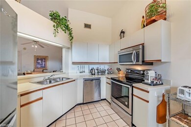 Kitchen featuring stainless steel appliances, ceil