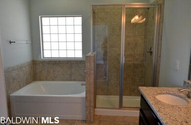 Master Bathroom with Garden Tub w/ Tile Surround a